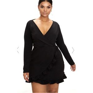 Black faux wrap dress. Above knee on me 5’3”. Size 16. Back zip.